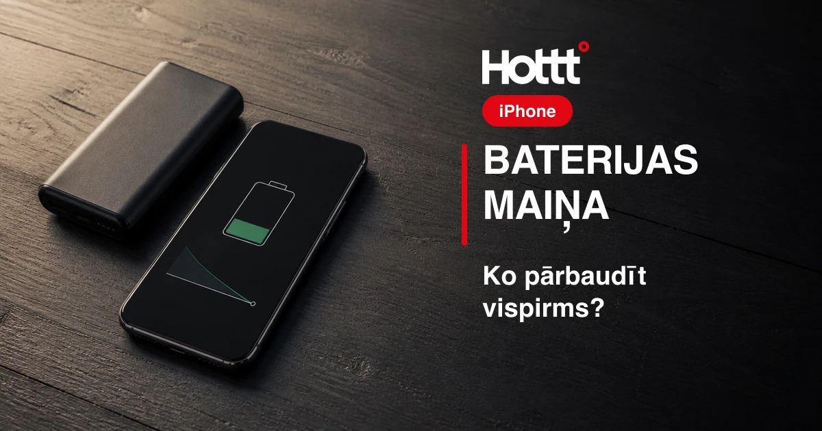 Telefons ar zemu uzlādes līmeni un power banka uz tumša galda.
